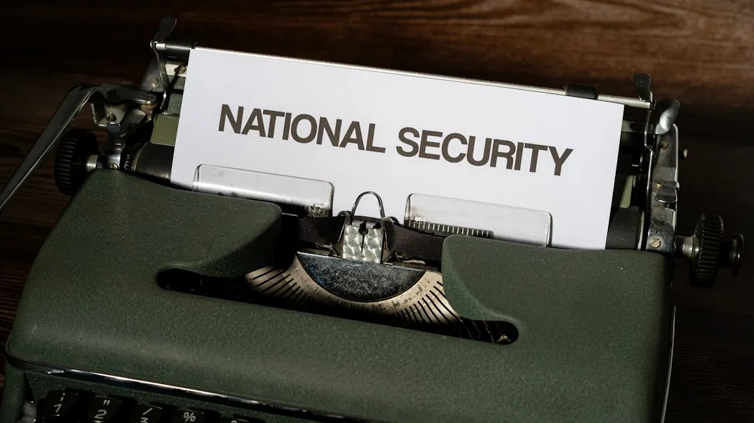 a close up of a typewriter with a national security sign on it