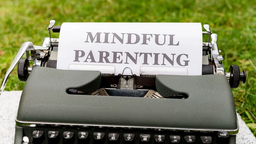 a close up of a typewriter with a paper that says mindful parenting