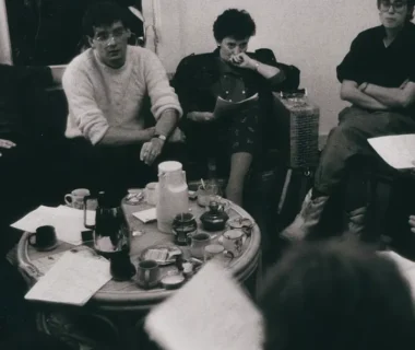 a group of people sitting around a table