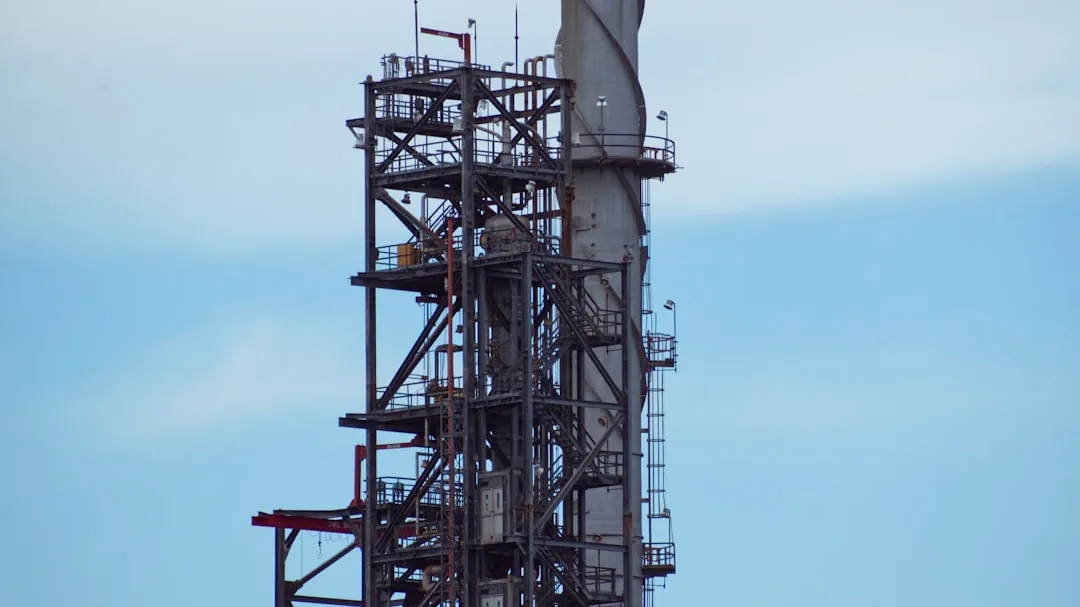 A large metal structure with a clock on top of it
