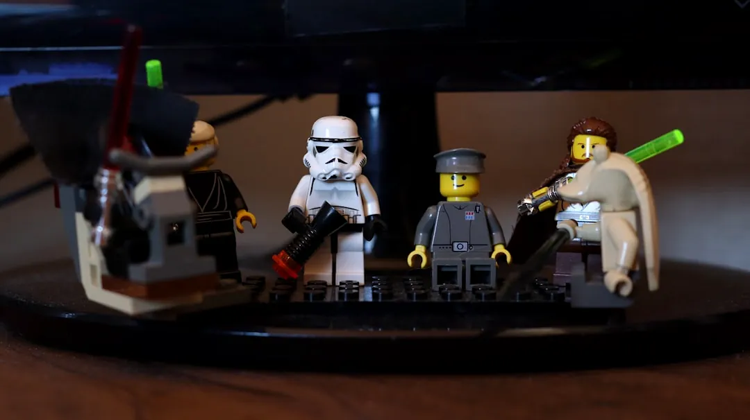 A lego star wars scene is displayed on a desk