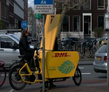 a person riding a bike on a city street