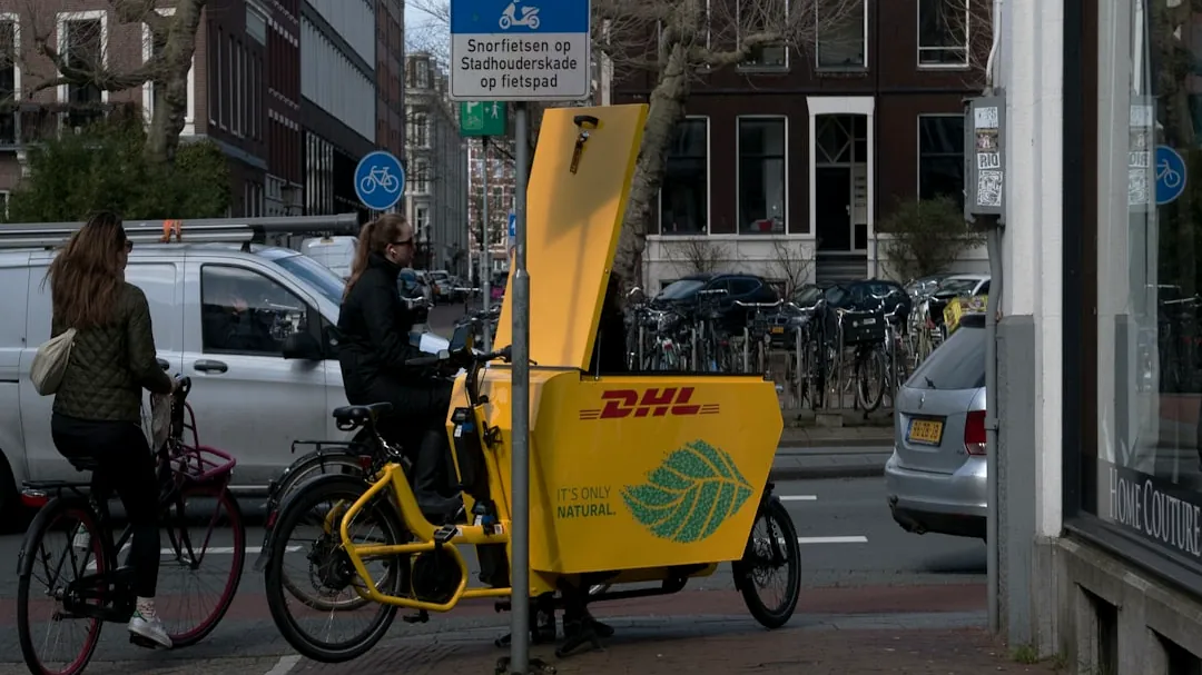 a person riding a bike on a city street