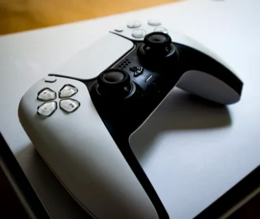 A playstation 5 console with its controller.