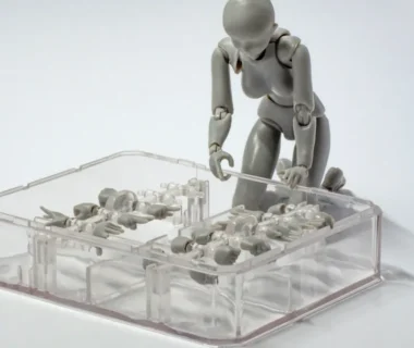 a small plastic man standing on a table