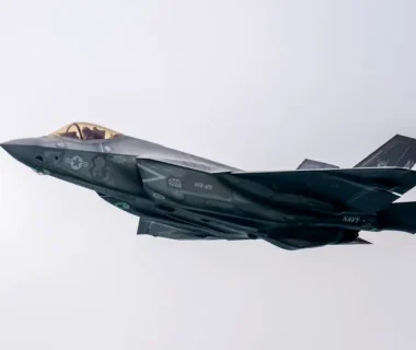 A state-of-the-art military stealth fighter jet soaring through the sky.