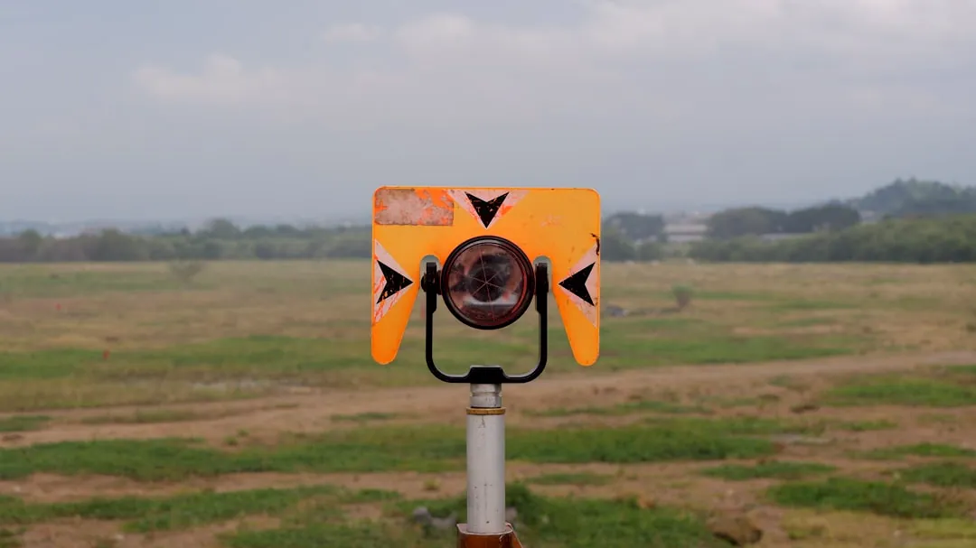 A yellow and black object in a field
