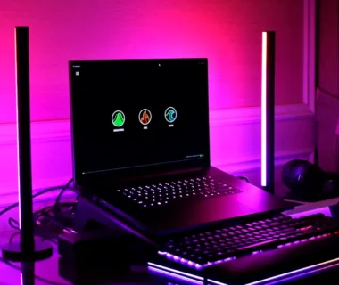 Gaming setup with laptop, keyboard, and rgb lighting.
