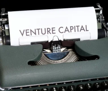 green and white typewriter on black textile