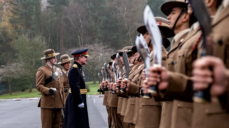 Gurkha soldiers in uniform with kukri knives during a military ceremony in Catterick, England.