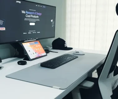 Modern desk setup with computer and ergonomic chair