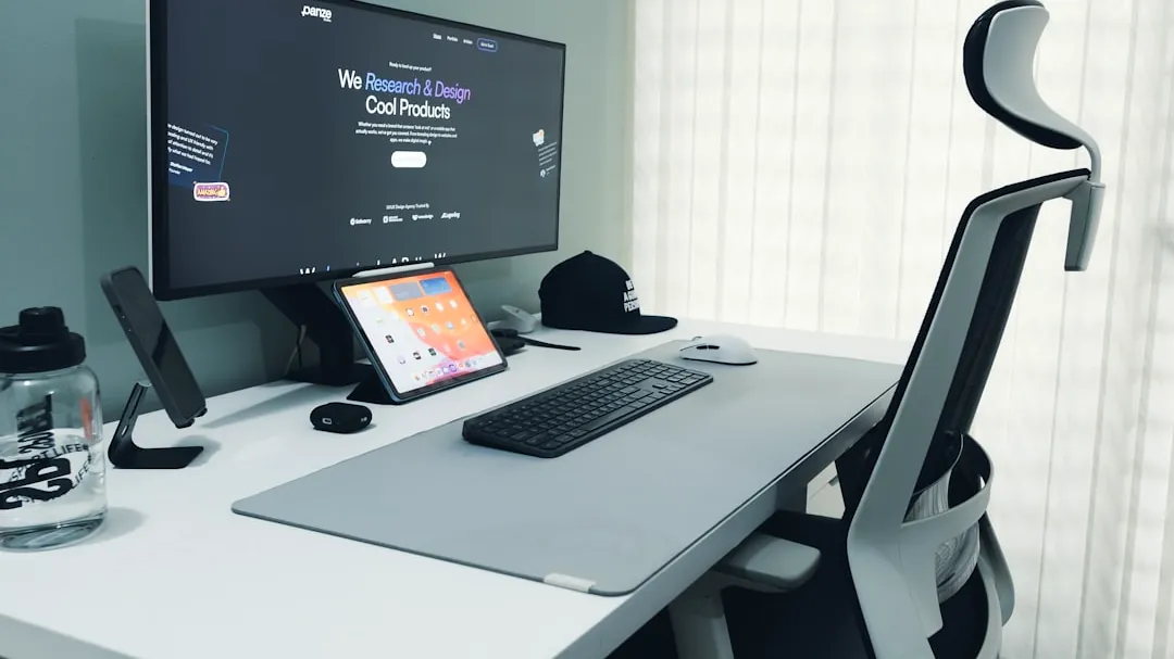 Modern desk setup with computer and ergonomic chair