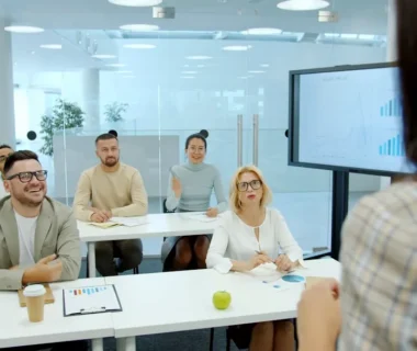 People listen attentively during a business presentation.