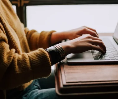 person sitting front of laptop