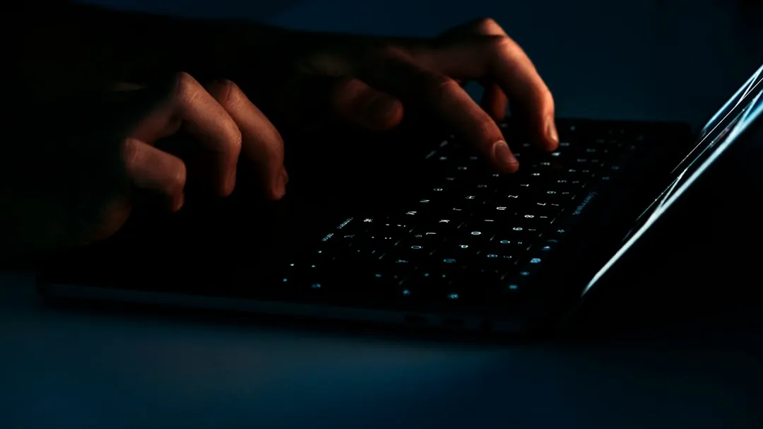 person using black laptop computer