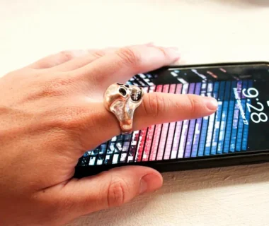 person wearing silver-colored ring