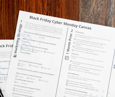 two black friday cyber monday games sitting on top of a wooden table