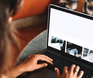 woman using macbook pro on table