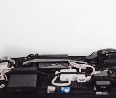 a black case filled with electronics on top of a white table
