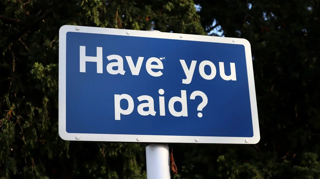 a blue sign that says have you paid?