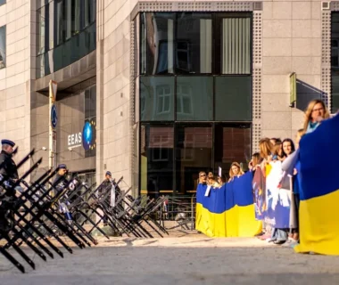a group of people in clothing outside a building