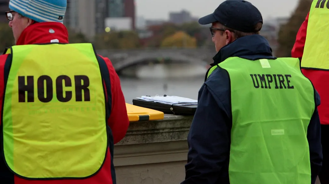 a group of people standing next to each other near a river