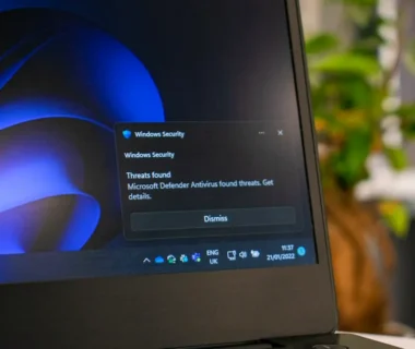 a laptop computer sitting on top of a table