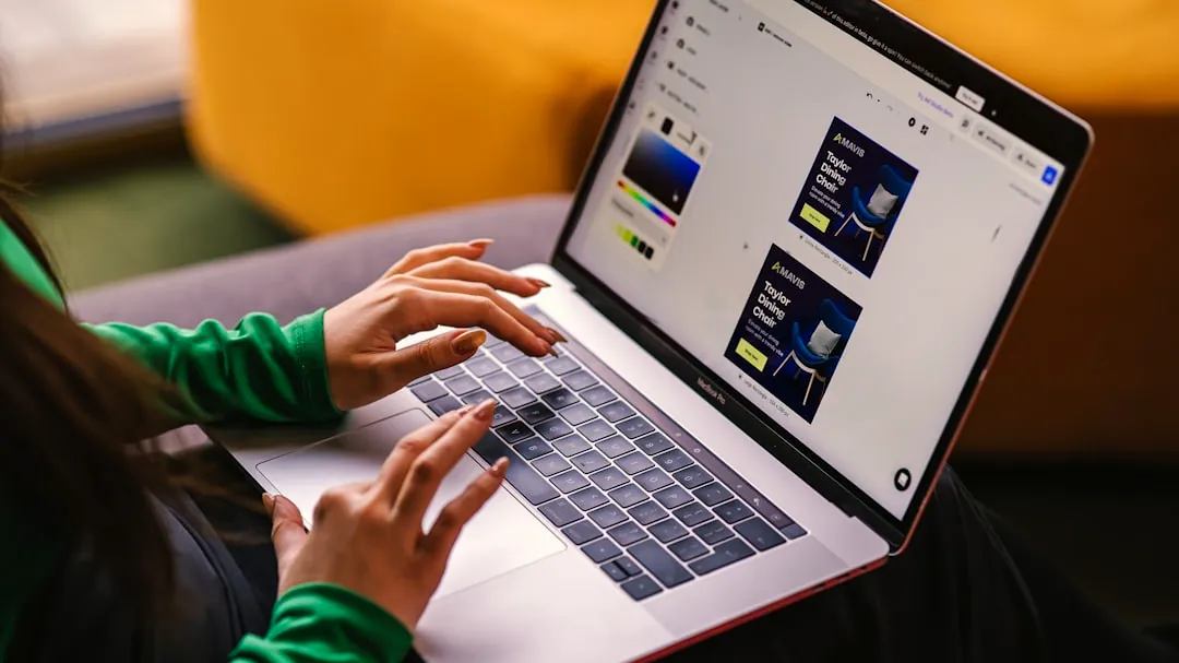 a woman sitting on a couch using a laptop computer