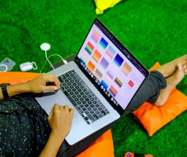 macbook pro on orange textile