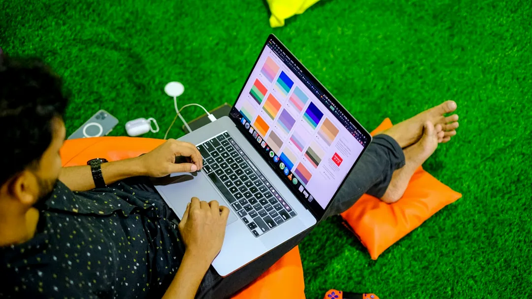 macbook pro on orange textile