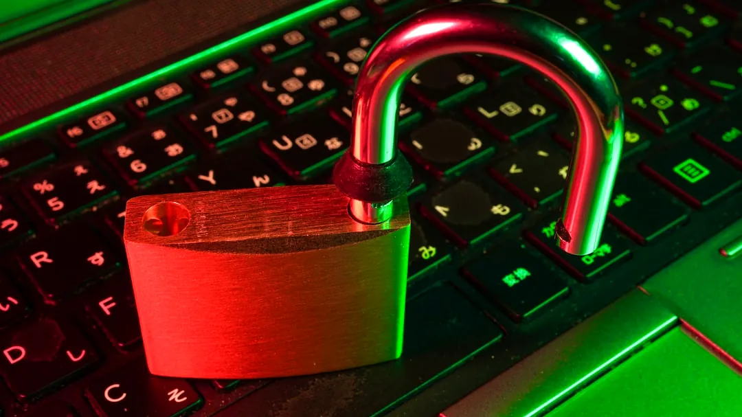 red padlock on black computer keyboard