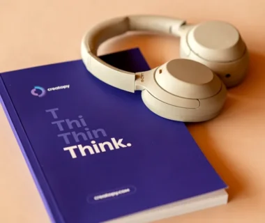 a book with a pair of headphones on top of it