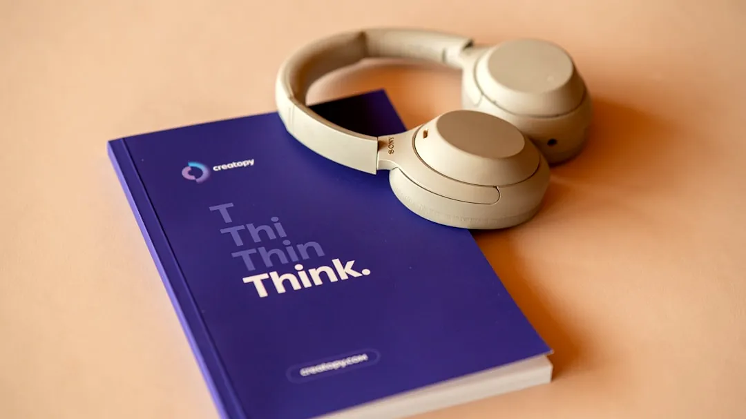 a book with a pair of headphones on top of it