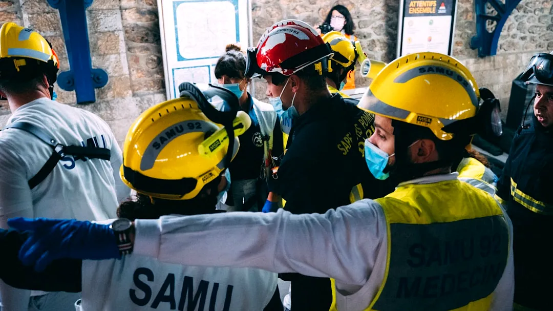 a group of people wearing hard hats and safety gear