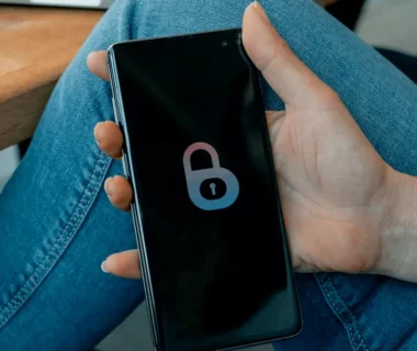 black and white smartphone on persons hand