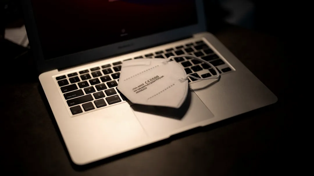 macbook pro on black table