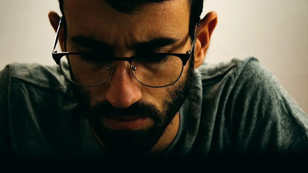 man in black framed eyeglasses