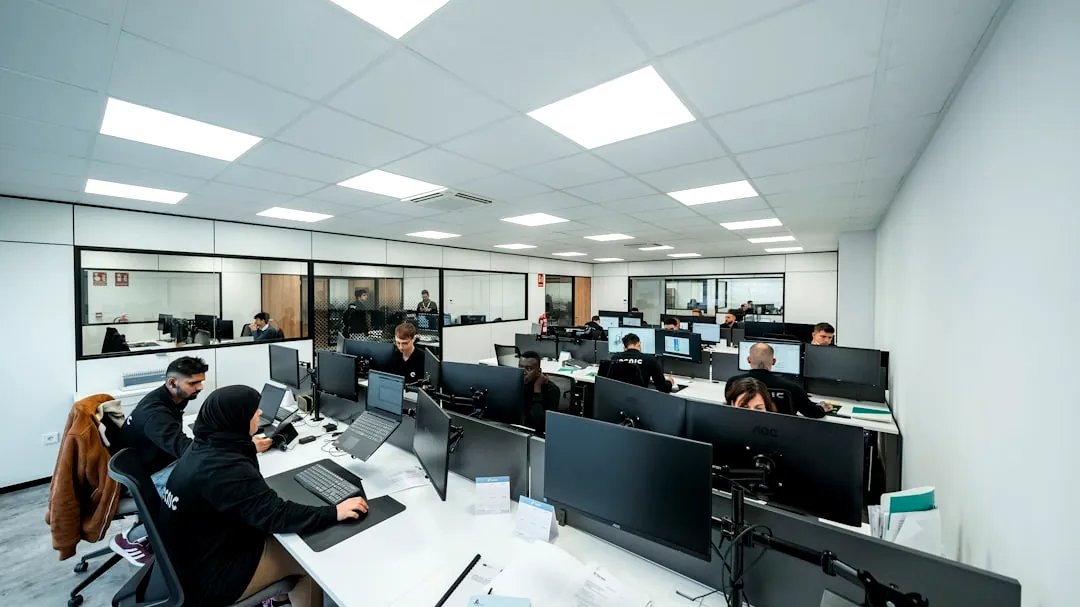 Office workers are busy working on computers.