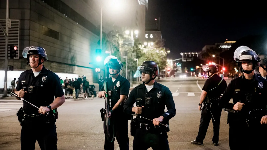 man in black shirt and pants holding black dslr camera