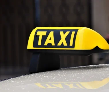 yellow and black taxi sign