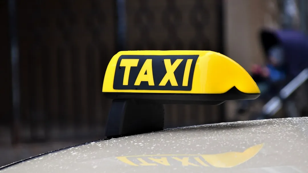 yellow and black taxi sign